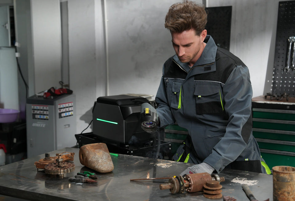 Workers are removing rust from the metal