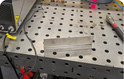 Dan Cognolato practicing simple stainless steel welding joints on a workbench.